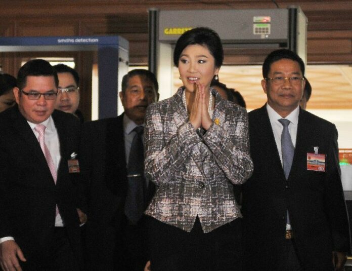 Yingluck arriving at the Parliament House for her final impeachment hearing on 22 Jan 2015.<br />