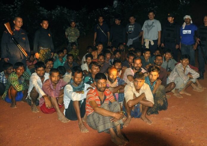 A picture made available on 12 October 2014 shows ethnic Rohingya refugees after Thai police officers arrested them in Phang Nga province, southern Thailand, 11 October 2014. Thailand will adopt a zero tolerance policy in combating human trafficking, after a US report slammed the country's performance on the issue. EPA/STR THAILAND OUT<br />