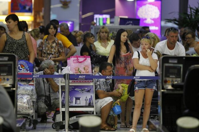 <br />
A file photo shows foreign tourists waiting at the departure hall of Suvarnabhumi Airport in Bangkok Thailand, 03 December 2013. Honeymooning couples will be fast-tracked through immigration for the month of February. EPA/HOW HWEE YOUNG