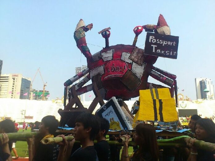 A parade float took a jab then-Prime Minister Yingluck Shinawatra, who is nicknamed 'Red Crab' by the Thai press, at the annual Chulalongkorn - Thammasat football match on 25 Feb 2012.