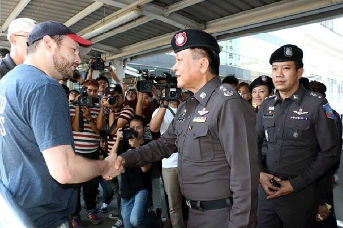 Police officers patrol the skywalk near Siam Paragon shopping mall on 5 February 2015, following the double bombings in the area last week.<br />