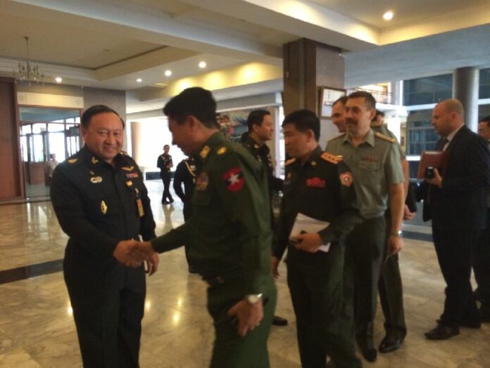 Thai military officers welcome foreign military attaches to a conference at the Army HQ in Bangkok on 11 Feb 2015.<br />