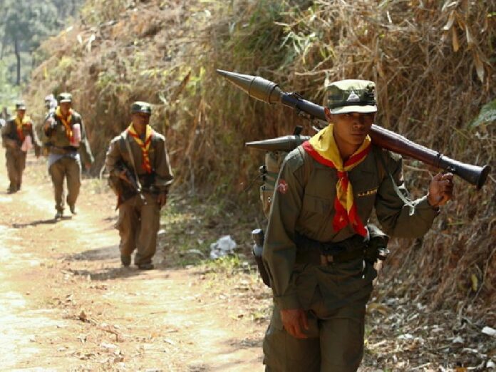 A file photo showing a group of armed Shan State Army (SSA) guerrillas patroling near the rebel jungle stronghold of Doi Tailang in Myanmar's Shan state, 06 February 2007. Myanmar troops clashed with rebels in Shan State, leaving 47 soldiers dead this week. EPA