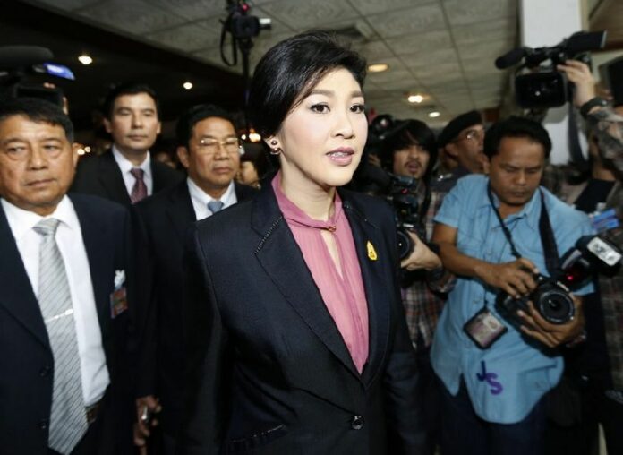 Former Thai prime minister Yingluck Shinawatra arrives to give her statement during impeachment proceedings against her, at the Parliament House in Bangkok, Thailand, 09 January 2015. Shinawatra was due to appear before the country's legislative body to face charges over a failed rice subsidy scheme. EPA/NARONG SANGNAK
