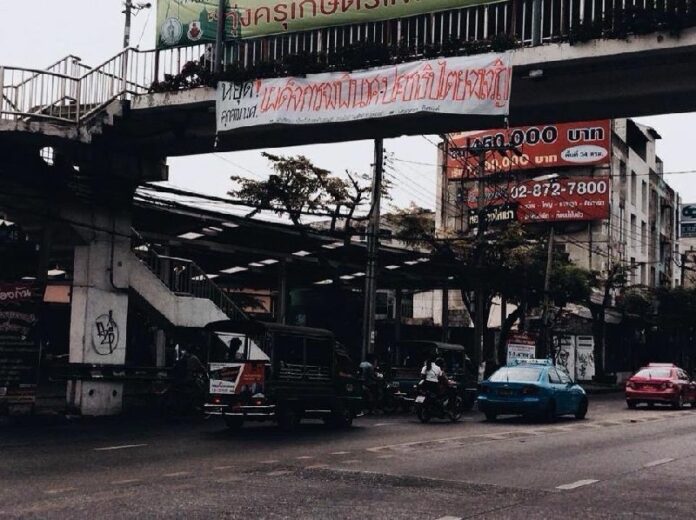 A banner hung near King Mongkut’s University of Technology that reads: Down With Dictatorship – Long Live Democracy.” Feb 19, 2015.