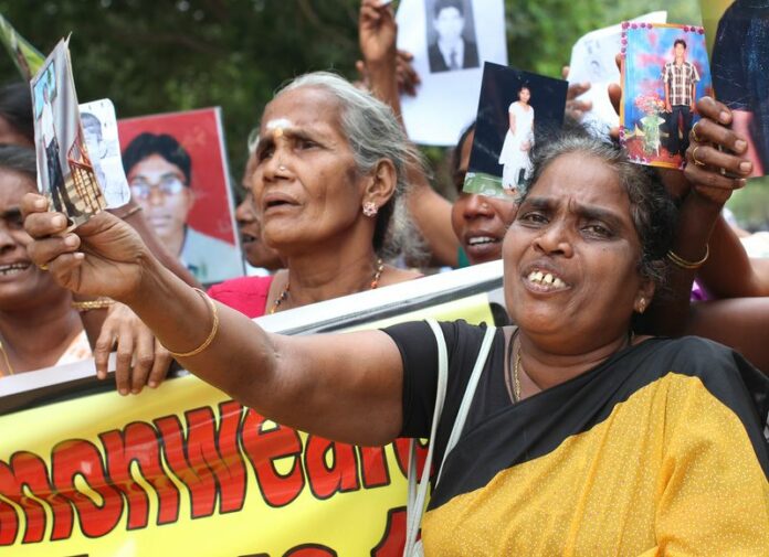 Relatives of people who disappeared during or after Sri Lanka's civil war and never showed up again protest in Jaffna, Sri Lanka, 15 November 2013. Tamil academics, politicians and activists staged an anti-United Nations protest Tuesday in northern Sri Lanka for its decision to delay a report on alleged crimes committed during the civil war, police officials said. Photo: Doreen Fiedler/dpa<br />
