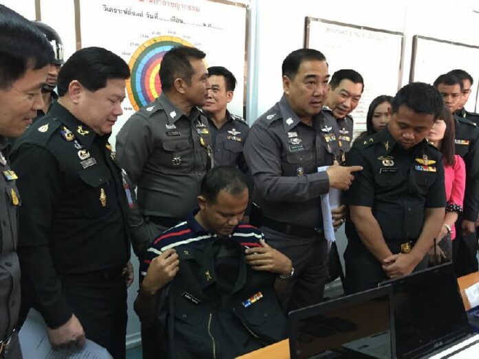 A police press conference with 2 men arrested for for disguising as military officers and selling fake Royal Thai Army ranks to more than 70 people who participated in two-month training sessions, 3 March 2015.