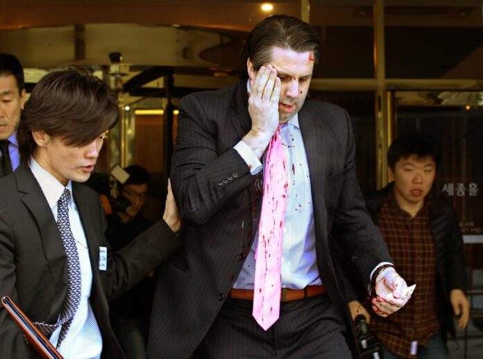 US Ambassador to South Korea Mark Lippert leaves Sejong Center for Performing Arts in downtown Seoul, South Korea, 05 March 2015, after being attacked by a knife-wielding assailant.<br />
