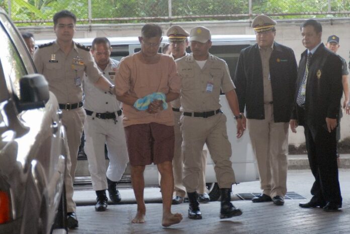 Apiruj Suwadee arriving at criminal court in Bangkok, where he was convicted of lese majeste, 11 March 2015.<br />