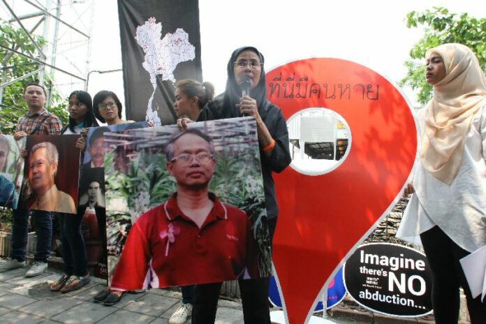 Activists, center Angkhana Neelapaijit, mark the 11th anniversary of the abduction of human rights lawyer Somchai Neelapaijit in Bangkok, 12 March 2015.