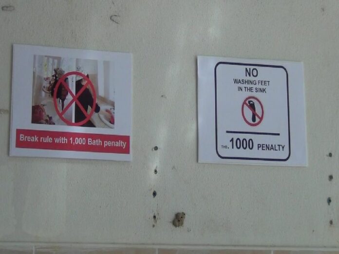 A sign in Pi Pi Islands National Park telling tourists not to wash their feet in the sink.