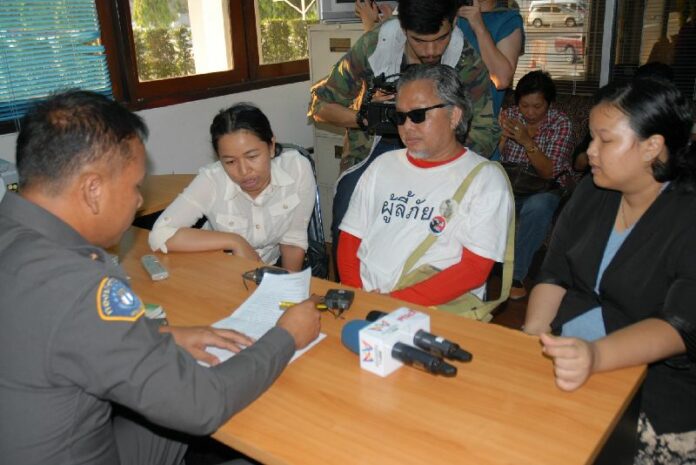 Pansak at the Crime Suppression Division filing charges of illegal detention against the police officers who detained him, 14 March 2015.