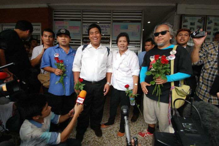 The four defendants at the Pathumwan Police Station on 15 March 2015.
