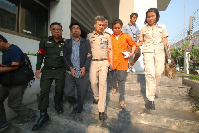 Supaporn "Dear" Mit-arak (orange), alleged mastermind of the terror plot, being taken to the court in Bangkok, 19 March 2015.<br />