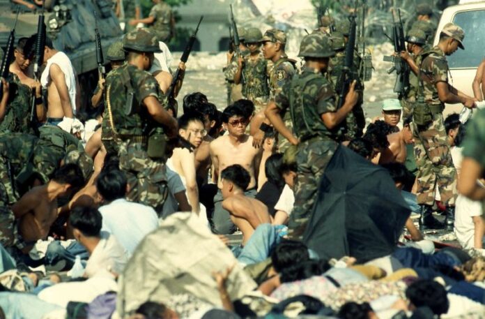 Soldiers detain protesters on Ratchadamnern Avenue in Bangkok, 18 May 1992