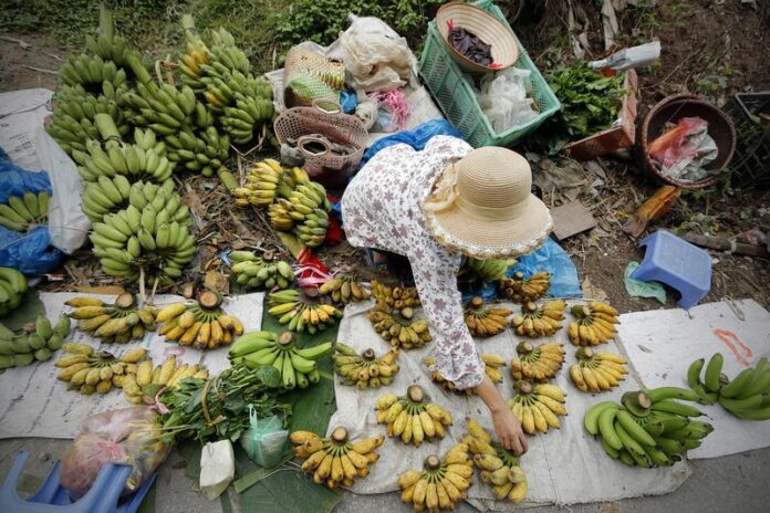 A woman sells bananas at a market in Hanoi, Vietnam, in a 2014 file photo. The country posted its fastest first-quarter growth for five years.<br />
