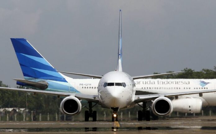 Garuda Indonesia aircrafts at Soekarno Hatta airport, Jakarata, Indonesia, 12 December 2014. An Indonesian man survived a one-hour flight from Sumatra island to Jakarta by hiding in the passenger jet's landing gear bay, media reports said Wednesday. EPA/MAST IRHAM<br />