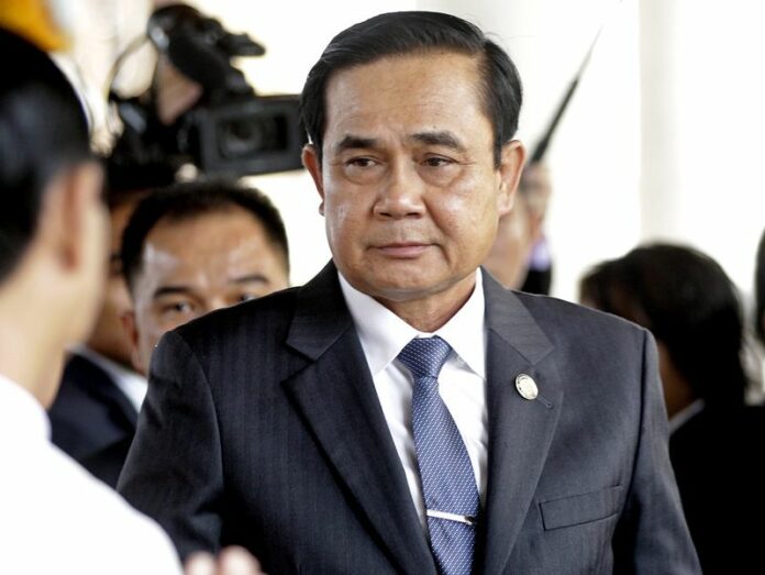 A file photo shows Thai Prime Minister Prayuth Chan-ocha at the Shwedagon Pagoda, Yangon, Myanmar, 10 October 2014. Chan-ocha will use his sweeping executive powers to tackle illegal fishing and human trafficking in the country's fishing industry. Photo: EPA/NYEIN CHAN NAING<br />