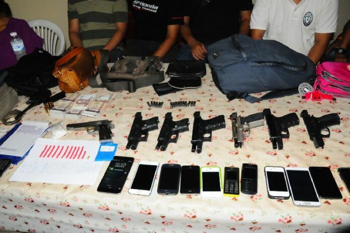 Objects confiscated from six police officers who have been accused of kidnapping a Laotian woman and her son in Nong Khai province, 27 April 2015.