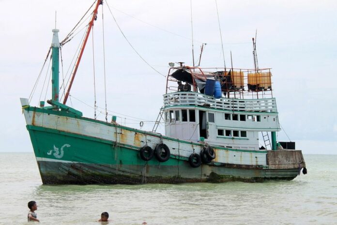 A traditional Thai style fishing boat which was used by Myanmar Rohingya refugees, stranded in Seunedon village of North Aceh, Sumatra, Indonesia, 11 May 2015. EPA/STR<br />
<br />
<br />
