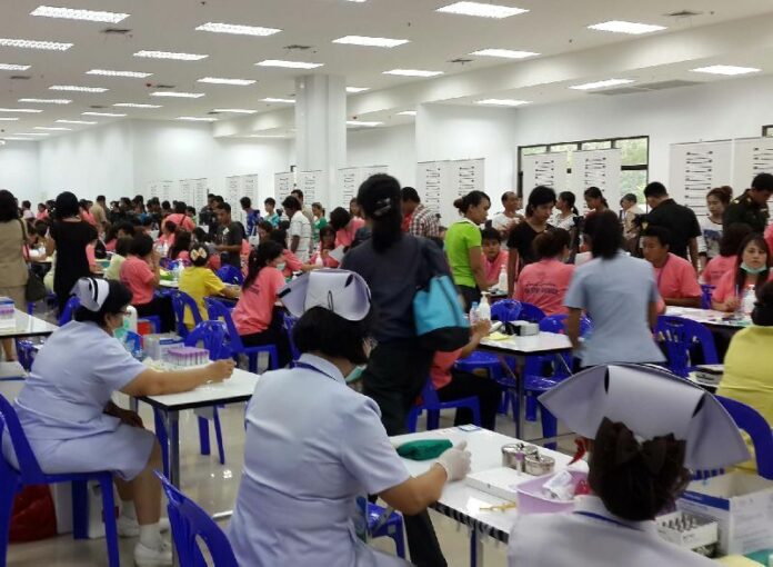A "One Stop Service" center in Samut Sakhon province for migrant workers to register and receive 60 day work permits, June 2014.<br />