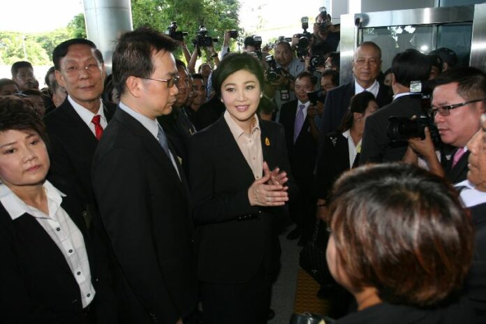 Former PM Yingluck Shinawatra arrived at the Supreme Court on 19 May 2015 to stand trial for alleged corruption in her government's rice program.