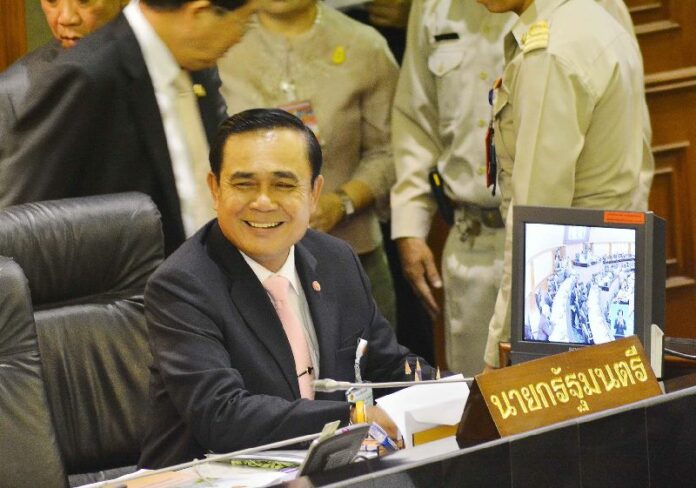 Gen. Prayuth flashes a rare smile during the parliamentary budget hearing on 21 May 2015.<br />