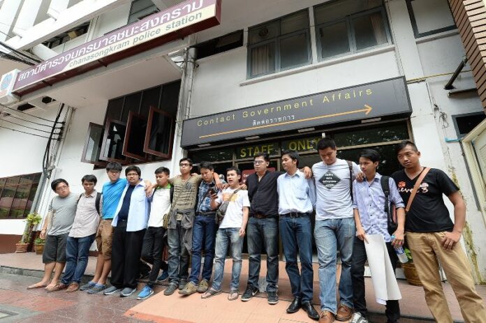 Activists from the Young People for Social-Democracy Movement (YPD) at the Chanasongkram Police Station in Bangkok, where police took them for interrogation after they read an anti-coup statement in public.<br />