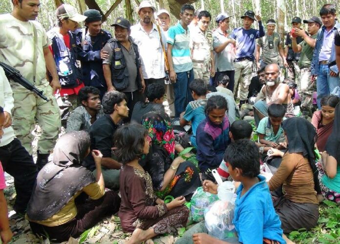 Security officers find 26 migrants from Myanmar and Bangladesh wandering in a jungle in Songkhla province, 11 May 2015.