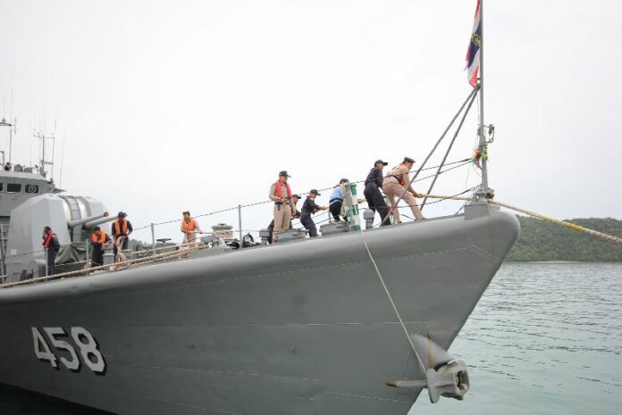A Thai navy vessel sets out to assist boats of migrants in Andaman Sea on 26 May 2015.