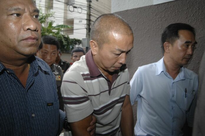Police bring former palace official Montri Sotangkul to Criminal Court in Bangkok on 16 June 2015.