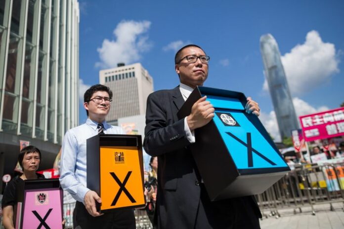 Pro-democracy supporters rally outside the Legislative Council in Hong Kong, China, 17 June 2015. EPA/JEROME FAVRE