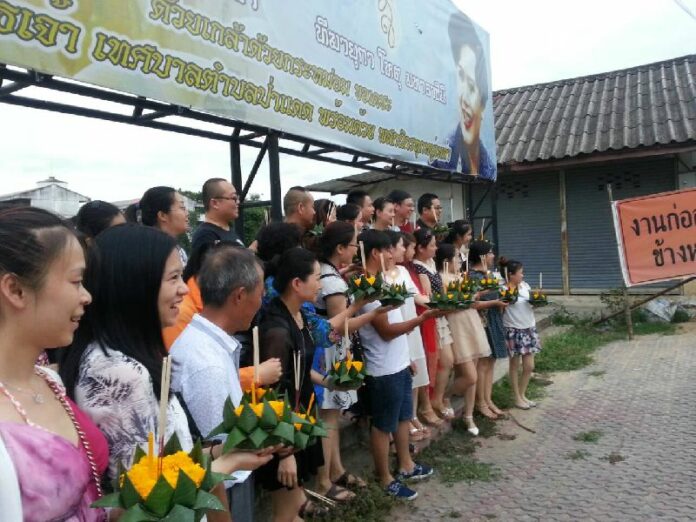 Chinese tourists in Chiang Mai celebrate a mock Loy Kratong festival five months early, 25 June 2015. <br />