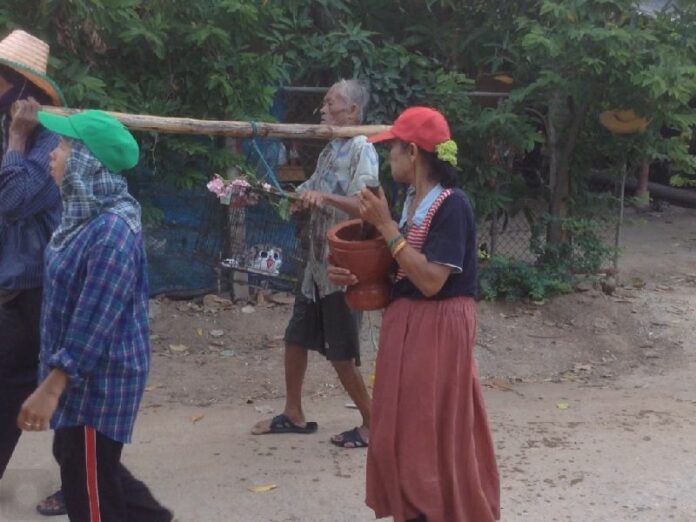 Farmers in Chainat use a Japanese doll in a traditional rain-summoning ceremony, 5 July 2015.