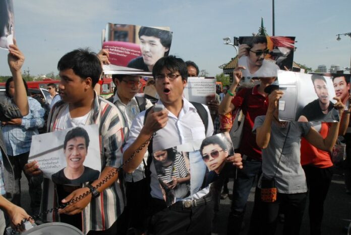 Supporters of the jailed activists rally outside of Bangkok's martial court to demand their release on 7 July 2015.