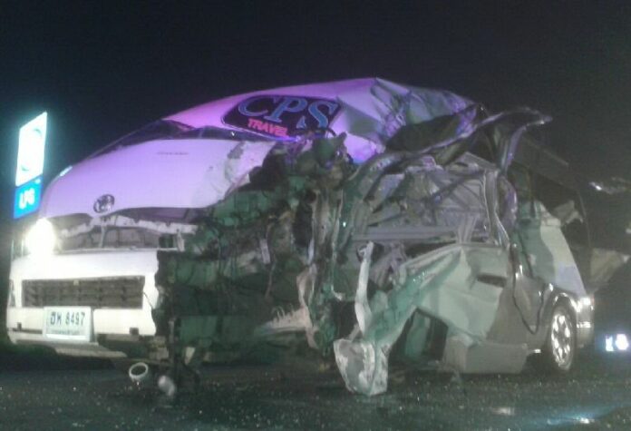 A van was totaled after it crashed in the back of a parked truck in Sa Kaeo province, 7 July 2015.