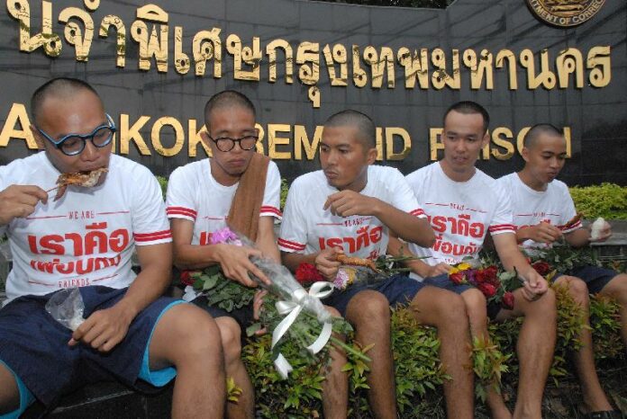Activists eating grilled chicken after they are released from Bangkok Remand Prison on 8 July 2015.