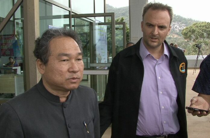 Nakhon Chompuchat (L) and Andy Hall (R) speaking to reporters outside the court on 9 July 2015.<br />