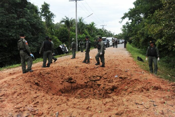 The crater caused by a roadside bomb in Narathiwat that killed one ranger and injured six others, 14 July 2015.<br />