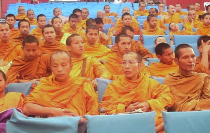 Monks gather for a meeting with police in Nakhon Si Thammarat about promoting road safety, 28 July 2015.<br />
