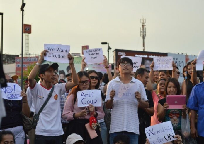 Demonstrators stage a protest against the military junta in Bangkok on 25 May, 2014