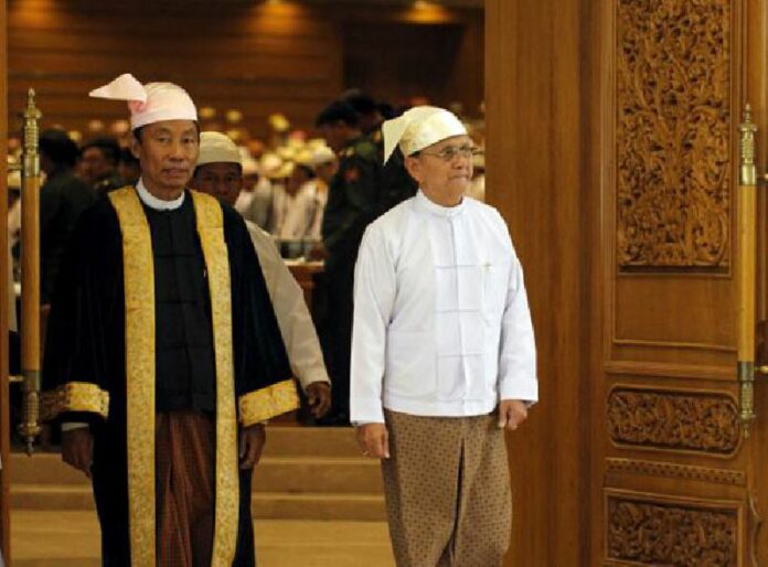 Shwe Mann (L), Speaker of the Union Parliament, and Myanmar's President Thein Sein exit the Union parliament in Nyapyitaw in this 26 March, 2014, file photo.<br />