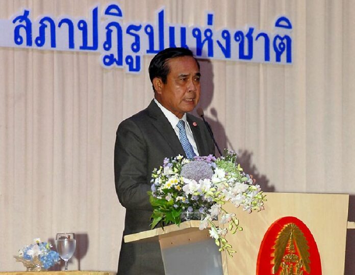 Junta chairman Gen. Prayuth Chan-ocha speaks at a news conference today. Earlier, he blasted critics of the draft constitution written by his appointees.