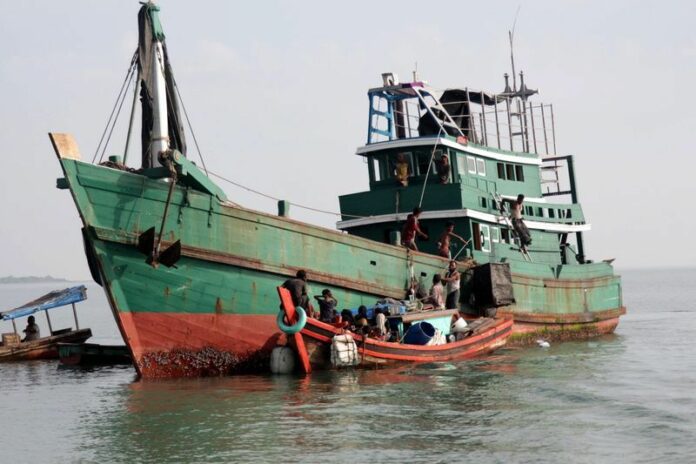 A boat loaded with nearly 400 Myanmar Rohingya and Bangladeshi refugees was pushed away repeatedly from Thailand in May 2015 before being rescued by fisherman in Sumatra, Indonesia. File photo: EPA/STR