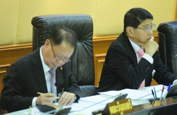 Deputy Prime Minister Visanu Krue-ngma (right) listens to a debate in the interim parliament today in Bangkok.
