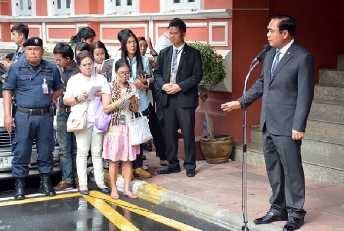 Junta chairman Prayuth Chan-ocha speaks to reporters this afternoon at Government House in Bangkok.
