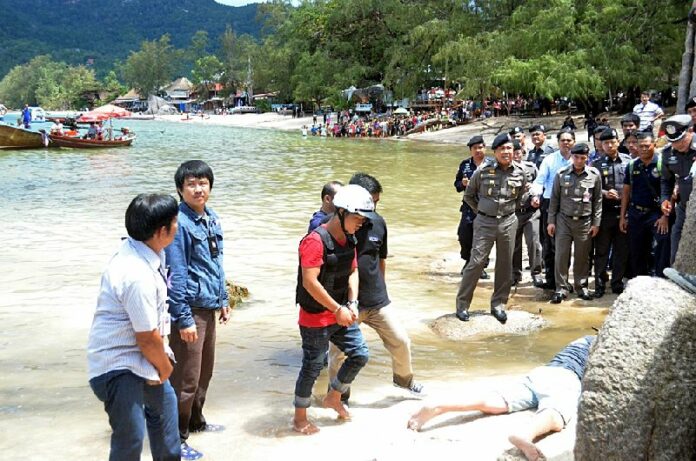 Zaw Lin and Wai Phyo are guided through a 're-enactment' of this past September's double-murder on Koh Tao in this 3 Oct., 2014, file photo.