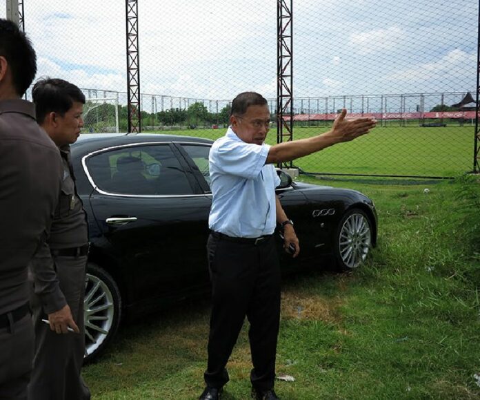 Former MP Wattana Mueangsuk shows police today where he alleged a soldier assaulted him Saturday as he was leaving a football field.