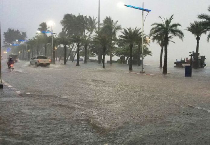 Waves sweep over Pattaya's Beach Road yesterday.