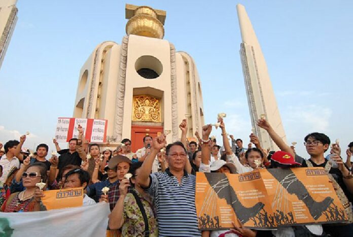 Demonstrators rally in 2015 at Democracy Monument on the ninth anniversary of the 2006 coup which removed former Prime Minister Thaksin Shinawatra from power.